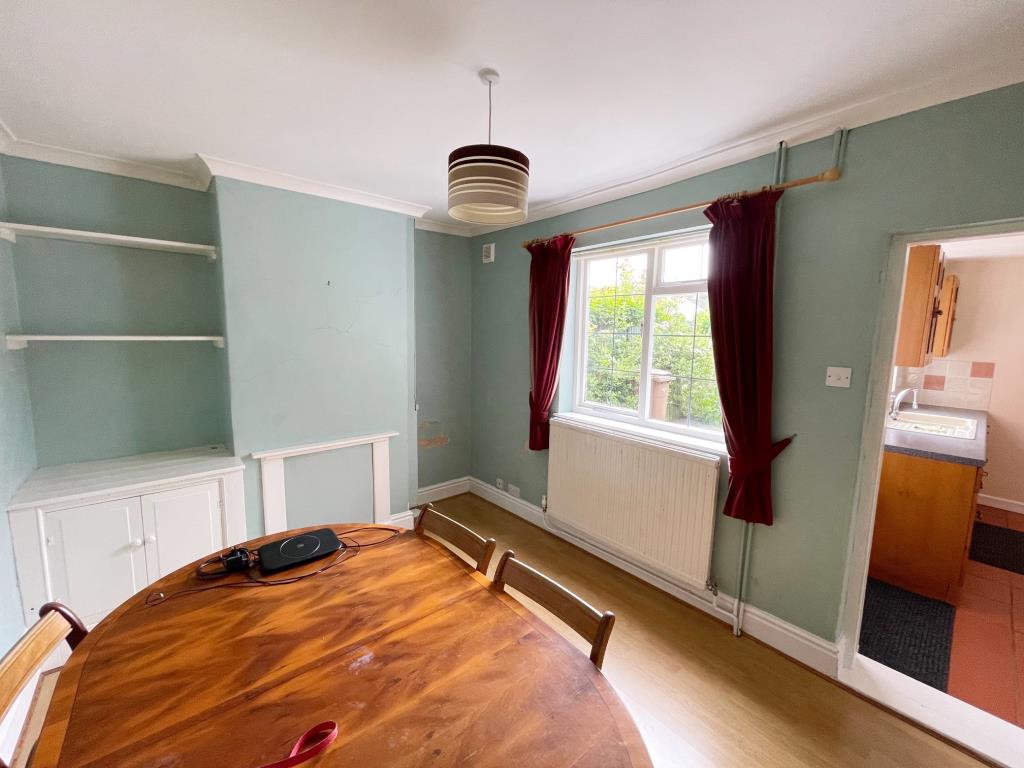 Lot: 134 - THREE-BEDROOM COTTAGE FOR IMPROVEMENT - Dining Room with access to Kitchen and window to rear